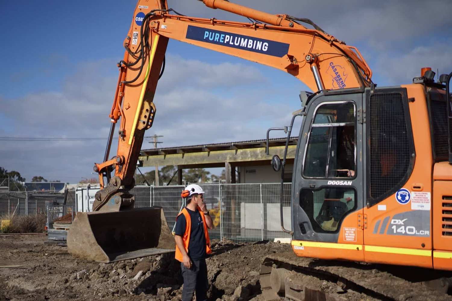 Pure Plumbing excavator trenching for new drainage